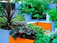 View over planters to seating area, Chelsea flower show, 2002: A moveable, modular garden. Design: Natalie Charles