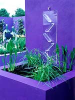 Perspex water cascade directs water into small raised pond. Design: Jane Mooney, a versatile garden for modern living, HCFS, 2002