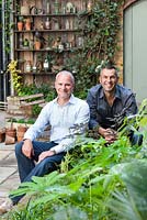 Portrait of Adam Woolcott and Jonathan Smith in Lucille Lewins, small courtyard garden, London. Designed by Adam Woolcott and Jonathan Smith 