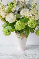 Bouquet of Rosa 'Avalanche', Guelder Rose and Stocks in a vase
