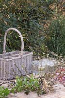 Materials required are glass jars, a wicker basket, secateurs, Willow blossom, Cherry blossom, Elderberry blossom and Pyracantha blossom