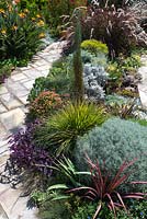 Overhead view of garden with a mixed planting of perennials, grasses and succulents.