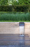 Box hedging with contemporary water feature. The Laurent-Perrier Graden. Design: Luciano Giubbilei, Gold Medal winner, Chelsea 2009