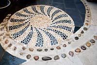 Inlaid pebble mosaic flooring 
