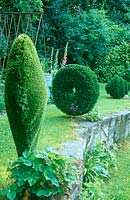 Astrotuf spiral, disc and heart by sculptor Lucy Strachan, positioned alongside the vegetable patch in her garden