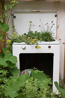 Old cooker with plants, overgrown - Frankensteins Nature, Designers: Anca Panait and Greg Mekle, Festival International des Jardins 2016, Domaine de Chaumont sur Loire, France