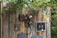 Plants growing through disused electrical switchboard - Frankensteins Nature, Designers: Anca Panait and Greg Mekle, Festival International des Jardins 2016, Domaine de Chaumont sur Loire, France