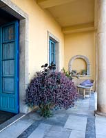 Marble terrace with container by door. Casa Cuseni in Taormina, Sicily, Italy
