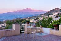 Early morning view of Etna from one of the terraces. Casa Cuseni in Taormina, Sicily, Italy 