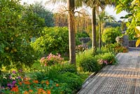Rachel has infused the arabic garden with a delicious concotion of fruits, flowers and exotic palms. San Giuliano Estate. Sicily, Italy