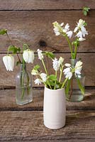 White spring floral arrangement with Fritillarias, muscari and hyacinthoides