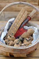 Planting Potatoes, Wooden trug with seed potatoes, hand trowel and wooden ruler, UK,  March