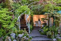 Senri Sentei - Garage Garden, a space to relax surrounded by a curved staircase with a white banister, leading to roof garden. The RHS Chelsea Flower Show 2016. Designer: Kazuyuki Ishihara - Sponsor: Senri-Sentei Project - GOLD
