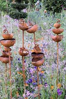 Rusty metal birdseed cups by Moore Designs - Greening Grey Britain Garden, RHS Chelsea Flower Show 2016, Design: Ann-Marie Powell