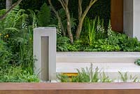 Garden of Mindful Living with limestone rill water feature and corten steel wall, planted with Blechnum tabulare, Primula, Sagina 'Senior', Matteuccia struthiopteris, Dryopteris erythrosora, Digitalis 'Dalmatian White' and Hosta 'Devon Green'. The RHS Chelsea Flower Show 2016 - Designer: Paul Martin - Sponsor: Vestra Wealth LLP - GOLD