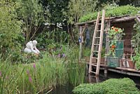 A floating garden with a raised wooden shack with living roof. When the waters rise, RHS Tatton Flower Show 2011, Cheshire