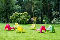 Plastic chairs on the lawn. Hunting Brook Garden, Co Wicklow, Ireland