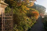 Paradise Walk in autumn. Borde Hill Gardens