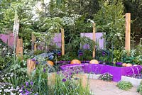 The Together We Can Garden. A contemporary garden inspired by sound, featuring a water marimba with york stone spheres. Sponsor: Papworth Trust. Designer: Peter Eustance. RHS Chelsea Flower Show 2016
