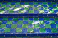 Green and blue tiled steps in the Jardin Majorelle. Created by Jacques Majorelle and further developed by Yves Saint Laurent and Pierre BergÃ©, Marrakech, Morocco