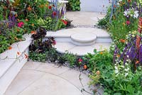 New Horizons City Garden. Stepped Patio with colourful Planting. Designers: Beautiful Borders Sponsors: Beautiful borders Garden Design. RHS Hampton Court Palace Flower Show 2016