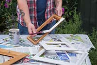 Repaint the picture frame over some newspaper