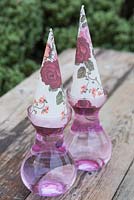 Hyacinth gifts in pink glass vases topped with decorative wrapping paper