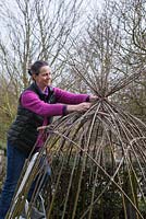 Gather the ends of the Willow sticks and tie together with twine to form the peak