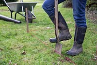 Dig along the string guide to mark the perimeter of the arbour base