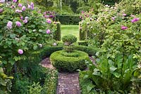 Rose garden with Sbox parterre. 'Rosa gallica 'Officinalis'' Rose., Rosa gallica 'President de Seze'. Sarina Meijer garden