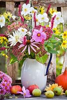 Jug of late summer flowers: Dahlia, Sunflower, Persicaria, Coneflowers, Anemones, Asters, Marigolds, Cosmea.