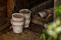Detail of terracotta pots inside shed - Macmillan Legacy Garden - RHS Malvern Spring Show 2016