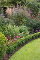 Mixed border with Buxus sempervirens edging