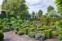 Courtyard garden featuring beds and clipped box and yew hedges. Frank Thuyls garden.