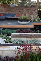 Seating inside of a pavillion. Plants include Kangaroo paw, succulents and Euphorbia