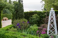 Painted wooden plant supports in summer parterre garden. Mitton Manor, Staffordshire. 