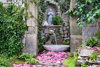 A shrine to the Virgin Mary in The Route of the Camellia Garden, RHS Hampton Court Palace Flower Show 2016