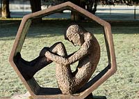 50p piece sculpture by Robert Berkoff in the classical gardens Trentham Staffordshire in January