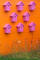 Coloured bird boxes in The Family Garden at BBC Gardener's World Live 2015