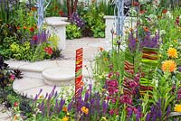 Circular steps amid a profusion of colour in the New Horizons garden at Hampton Court Palace Flower Show 2016