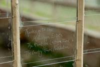 Etched glass pane in the restored greenhouse