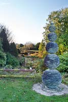 Joe Smith slate sculpture sits at viewpoint above garden