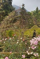 Wrought iron gazebo in rose garden with clipped hedges - Lake Atitlan Hotel , Guatemala