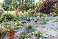 Little Ash Garden, Fenny Bridge, Devon. Autumn garden. Large gravel garden with paved path