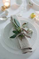 Eucalyptus and rosemary used to decorate napkins