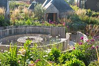 Pub garden with raised beds seating area with fire burner and late summer border, Jo Thompson garden Design, Ticehurst, East Sussex