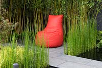Contempory red bean seat with Acer, Equisetum japonicum and bamboo