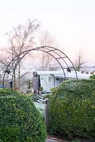 Arch with view through to the Railway Carriage, available for holiday lets