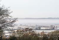 Early morning mist clearing over vast expanses of the Blackmore Vale