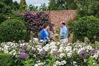 Mark and Angela Chambers, in their rose garden at Bretforton Manor.